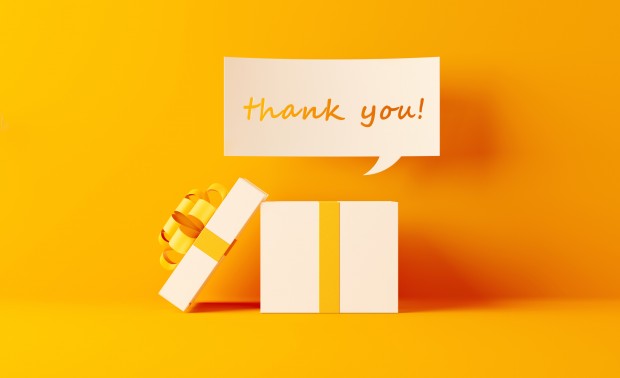 Shopping And Gift Concept- A Thank You Note Coming Out Of White Gift Box