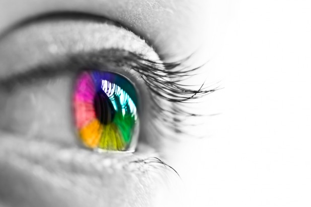 Girl colorful and natural rainbow eye on white background